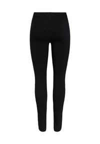 Jean skinny noir taille haute vu de dos, avec deux poches arrière et une silhouette ajustée.