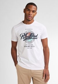 Camiseta de algodón blanca con un gráfico circular que incluye el texto "Miami Florida" y "RetroDad". Cuello redondo y mangas cortas.