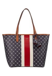 Velká námořnicky modrá taška přes rameno s opakujícím se bílým vzorem, červeným a krémovým pruhem, hnědými koženými uchy a ozdobným střapcem.