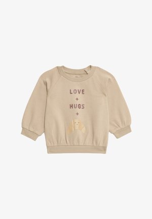 Felpa beige con maniche lunghe a sbuffo, polsini a coste e un orlo aderente. Presenta il testo "AMORE + ABBRACCI" e un'illustrazione di un croissant sorridente.