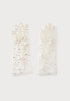 Gants blancs transparents ornés de petites et grandes perles réparties uniformément sur le tissu.