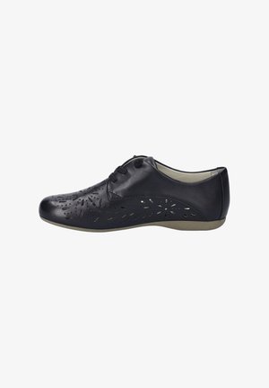 Scarpa in pelle nera con design floreali intagliati, punta tonda, allacciatura frontale e suola testurizzata. Presenta un profilo basso e una finitura liscia.