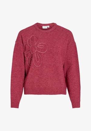 Red knitted sweater with a crew neck, featuring a textured flower design on the front and ribbed cuffs and hem. Soft material.