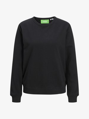 Black crewneck sweatshirt made of cotton. Features ribbed cuffs and hem, with a green tag label displaying "JJXX" at the neckline.