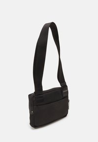 Calvin Klein REMOTE PRO CAMERA BAG - Skulderveske - black