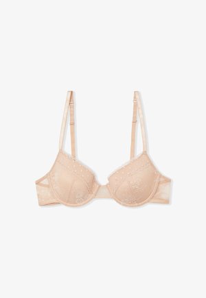 Reggiseno beige con ferretto in pizzo, spalline regolabili, ricami floreali e bordi smerlati, progettato per supporto e stile femminile.
