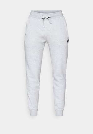 Gray sweatpants made of soft cotton blend, featuring an adjustable drawstring waistband, side pockets, and ribbed ankle cuffs.