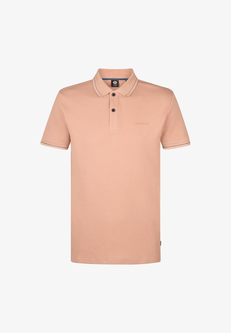 Polo shirt pêche clair en tissu texturé. Doté d'un plastron à trois boutons, d'un col avec une bordure contrastée et d'un logo discret.