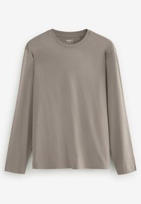 Lange mouwen, ronde hals T-shirt in licht taupe, gemaakt van gladde katoen met een eenvoudig ontwerp en geen zichtbare patronen of graphics.