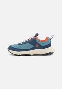 Sport shoes featuring a blue mesh upper, contrasting orange accents, white laces, and a thick rubber sole with a textured tread pattern.