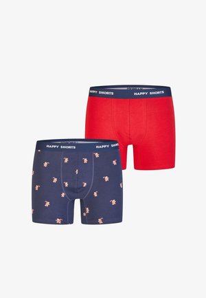 Een paar boxershorts: één rood en één marineblauw met een patroon van lichtgekleurde peperkoekmannetjes. Beide hebben een marineblauwe tailleband met de tekst "HAPPY SHORTS".