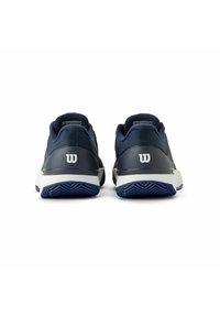 Marina tennis skor med en texturerad meshovandel och vita accenter. Tvåfärgad gummisula med zigzag-mönster, med en varumärkeslogotyp på hälen.