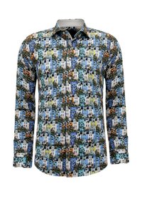 Lange mouwen blouse met knopen, bedrukt met een kleurrijke print van meerlaagse gebouwen en palmbomen in blauw-, geel-, oranje- en groentinten.