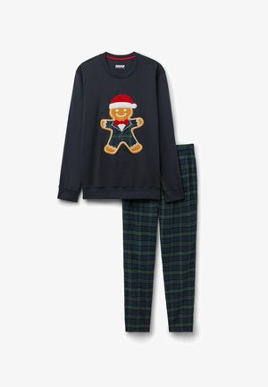 Haut à manches longues bleu marine avec un bonhomme en pain d'épices portant un chapeau de Santa et un costume à carreaux, associé à un pantalon à carreaux vert et bleu marine.