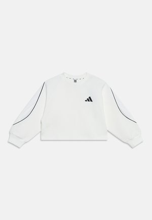 Sweat-shirt court blanc à manches longues avec logo adidas noir sur la poitrine et détails de passepoil noir le long des manches.
