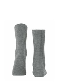 Calze a coste di colore grigio chiaro con una texture uniforme, con lunghezza fino al polpaccio e design della punta arrotondata. Senza elementi decorativi.