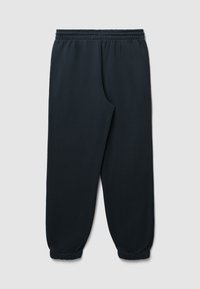 Pantaloni della tuta neri, elastici, con orli a cono e vita regolabile, realizzati in un materiale morbido e leggermente texturizzato.