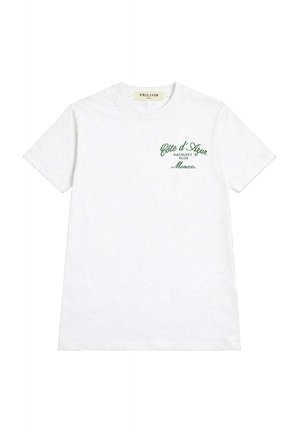 T-shirt blanc à manches courtes avec texte vert sur la poitrine gauche indiquant "Côte d'Azur Racquet Club Monaco" et col rond.