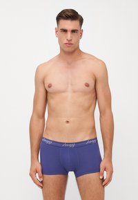 Dark blue boxer briefs made from soft fabric, featuring a snug fit and a grey elastic waistband with "sloggi" brand label.