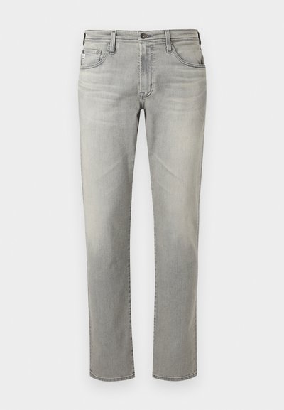 Šedé džíny z denimu se rovnou siluetou, pěti kapsami, zapínáním na knoflík a mírným vyblednutím. Hladký povrch a čisté linie.