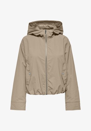 Veste cropped beige avec une capuche, fermeture éclair à l'avant et deux poches latérales. Fabriquée en tissu léger avec une texture lisse.