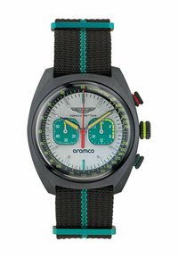 Zegarek chronograf z czarną kopertą, srebrną tarczą, zielonymi subtarcza i czarnym tekstylnym paskiem z turkusowymi akcentami oraz skalą tachymetryczną.