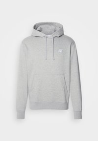 Sudadera gris hecha de una suave mezcla de algodón, con un bolsillo delantero, cordones y un pequeño logo blanco de Nike en el pecho.