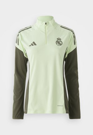 T-shirt de sport vert clair avec des manches vert foncé, à zip quart, et des rayures blanches ; arbore un logo sur la poitrine et une marque AeroReady.
