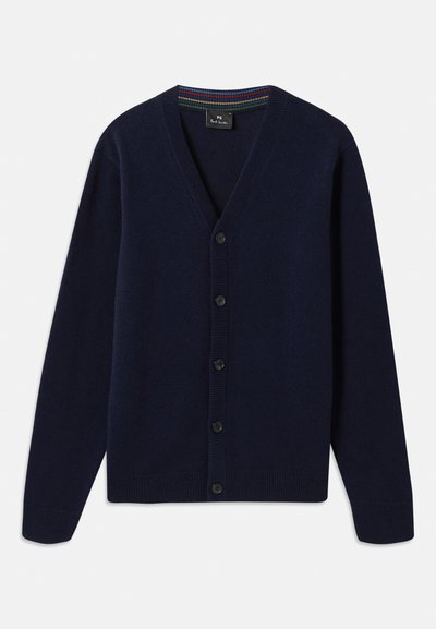 Tumši zila adīta kardigāna jakas ar V-veida kakla izgriezumu, priekšpuses pogu aizdari un ribota piegriezuma aproces. Iekšējais apkakles laukums ar daudzkrāsainām svītrām.