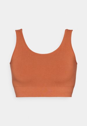 Braletka v barvě rezavé, bez švů, s kulatým výstřihem a širokými ramínky, vyrobená z měkké a elastické látky. Bez kovových detailů.