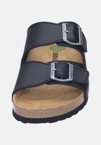 Black leather slide sandal featuring two adjustable straps with silver buckles, a cork footbed, and a textured rubber outsole.