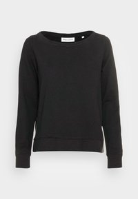 Svart långärmad sweatshirth med rundad halsringning och ribbade ärmslut. Mjuk tyg med en något lös passform och synliga sömmar.