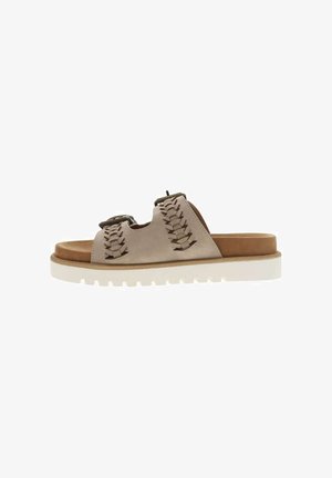 Light beige slip-on sandals with a textured, woven upper and a brown suede accent. Features a thick white sole and open design for breathability.