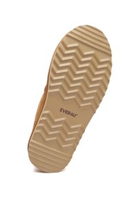 Brown suede shoe sole with a patterned, textured beige rubber outsole. Brand name "EVERAU" printed in dark brown. Zigzag traction design.