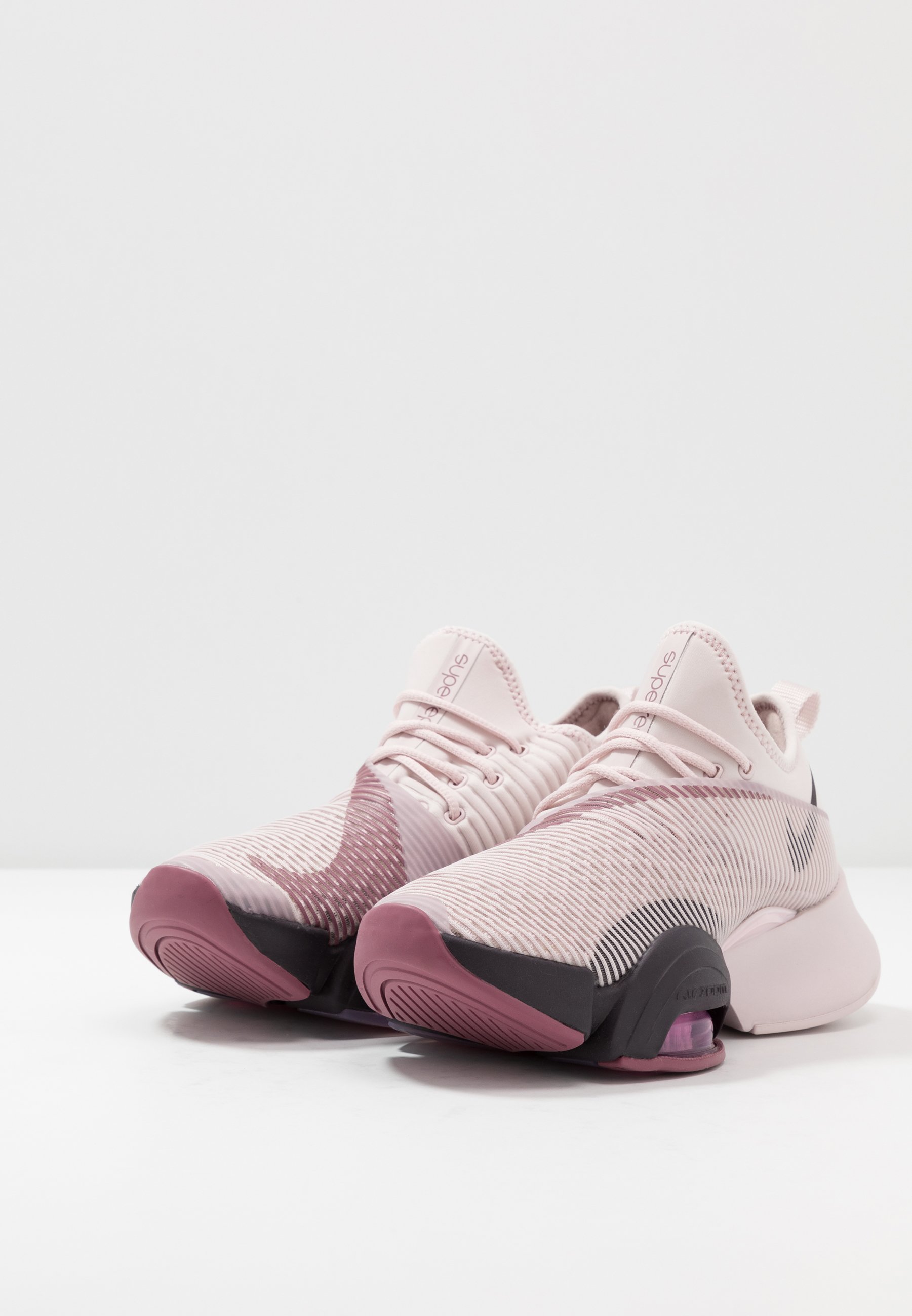 nike training air zoom superrep trainers in rose gold and burgundy