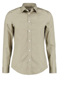 Langarmhemd aus leicht olivgrünem Baumwollstoff. Mit einem Button-Down-Kragen, Vorderknöpfen und einem abgerundeten Saum. Weicher Stoff.