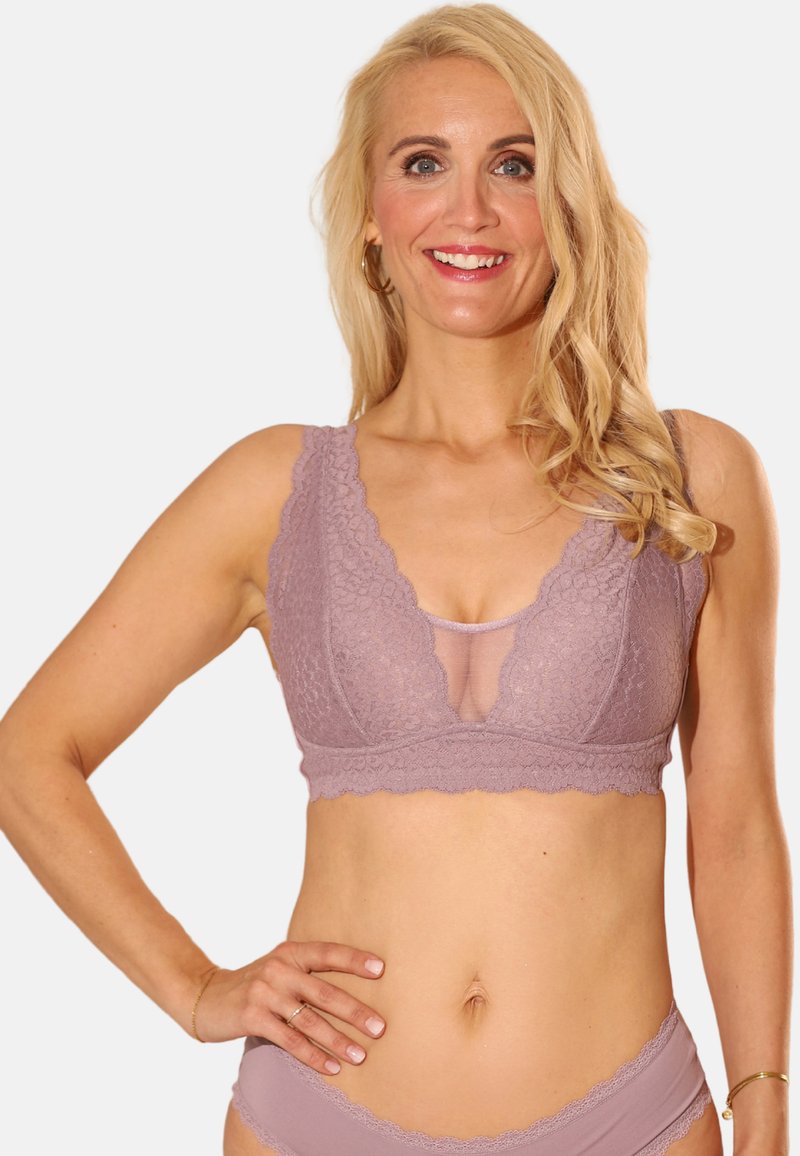 Lace bralette in lavender with a scalloped edge, featuring sheer mesh paneling at the center and wide straps for support.