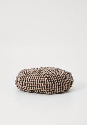 Baret s potiskom houndstooth v bež, rjavi in črni barvi; okrogla oblika z teksturirano tkanino in ravnim vrhom za udobno prileganje.