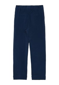 Pantalons en velours côtelé bleu marine avec une ceinture élastique, deux poches arrière et des poignets retroussés. Présente une texture à fines côtes sur l'ensemble.