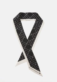 Black silk scarf featuring a geometric white stitched pattern and a cream-colored border. Signature label in the corner.