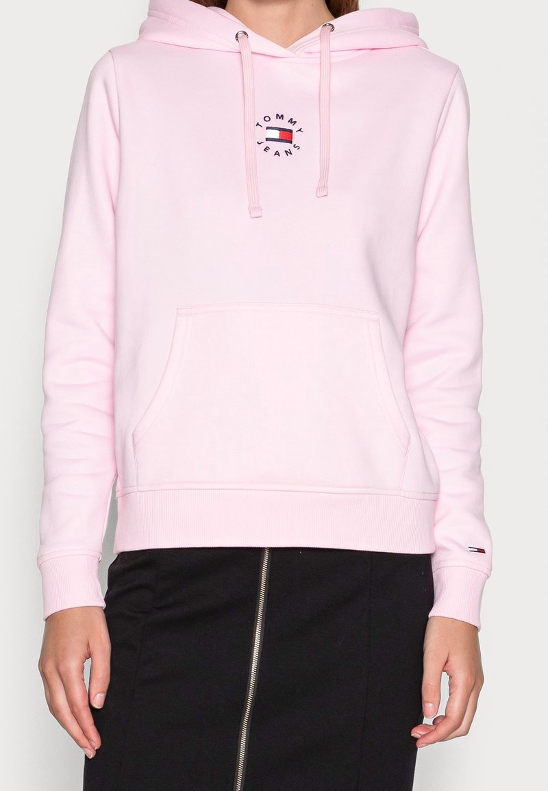 Felpa rosa in cotone, con tasca frontale e cappuccio con cordino. Presenta un logo tondeggiante e polsini e orlo a costine.