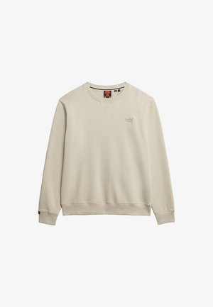 Sweatshirt crème clair à col rond en tissu doux. Présente des poignets et un ourlet côtelés, avec un petit logo à l'avant et une étiquette à l'intérieur du col.