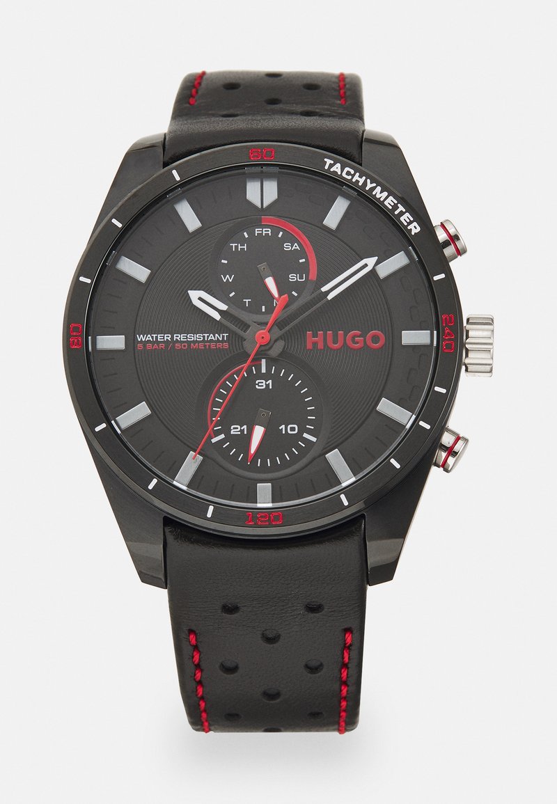 Black analog watch with a textured black face, red accents, and stainless steel details. Features a leather strap with red stitching. Water-resistant.