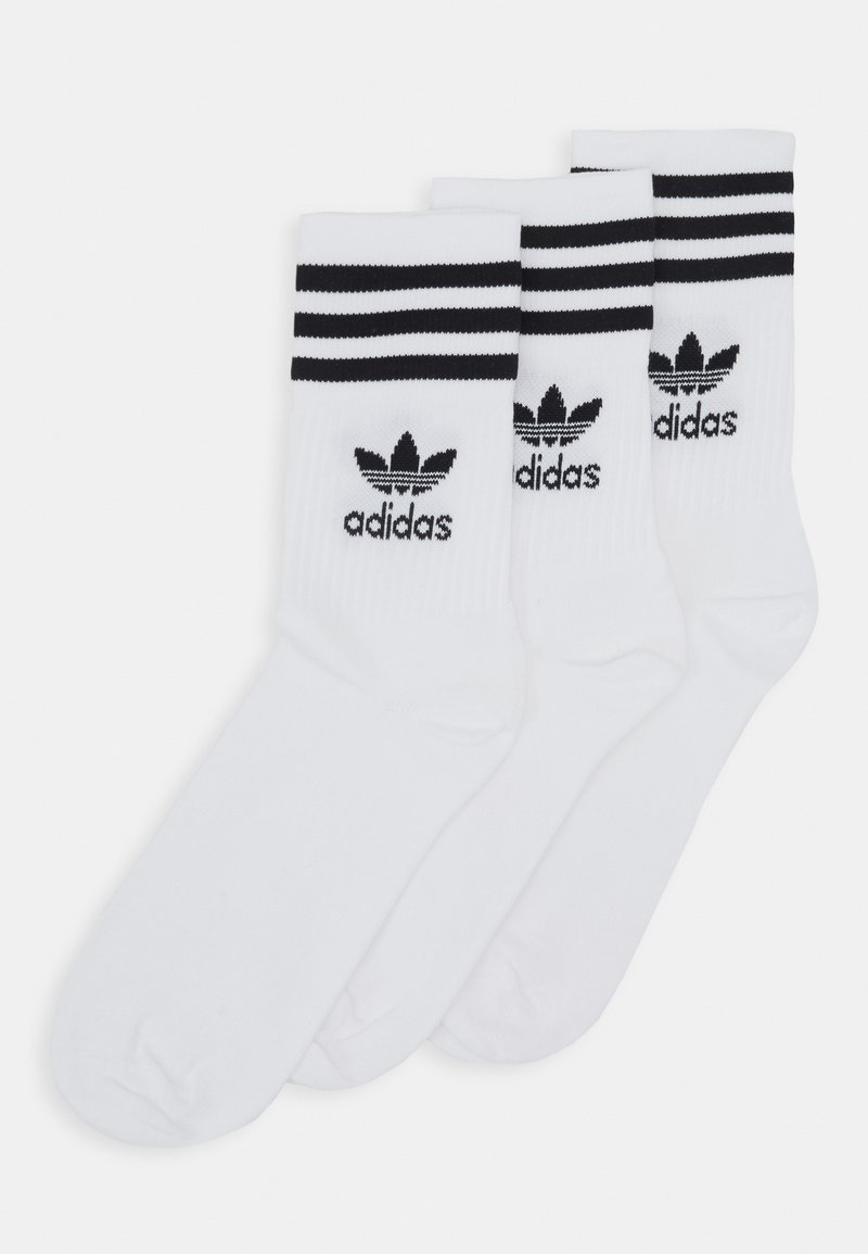 Bílé bavlněné ponožky s černými pruhy, na manžetě s logem Adidas. Sada tří párů, střední délka po lýtko, hladká textura.