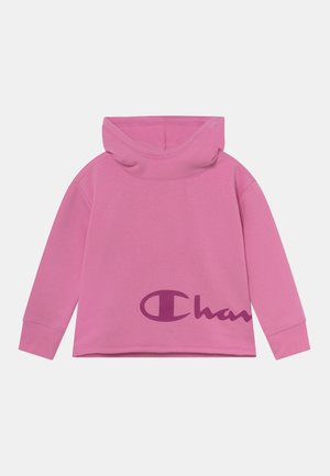 Pink langærmet rullekrave-sweatshirt med ribbede manchetter og delvist mørkelilla brandlogo på den nederste forside.