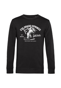 Černý svetr s dlouhým rukávem, který má bílý grafický potisk "COLORADO SPRINGS" a sportovce, s žebrovanými manžetami a výstřihem.