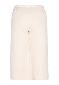 Helle beigefarbene Culottes mit strukturiertem Muster, elastischem Bund und weitem Bein. Das Material wirkt weich und leicht.