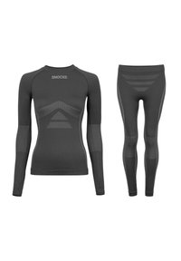 Black athletic long-sleeve top and leggings featuring textured panels, a fitted design, and reflective accents. Brand logo on the top.