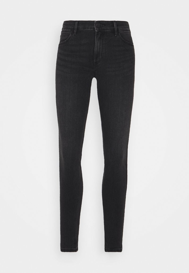 Pantalones vaqueros negros ajustados de mezclilla, con una cintura alta, diseño de cinco bolsillos y sutiles detalles desgastados en las piernas.