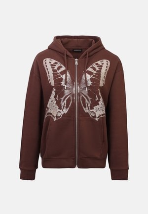 Bruine ritssluiting hoodie met een grote zilveren vlindergrafiek op de voorkant. Voorzien van een capuchon met trekkoord en geribbelde manchetten. Zachte stoftextuur.
